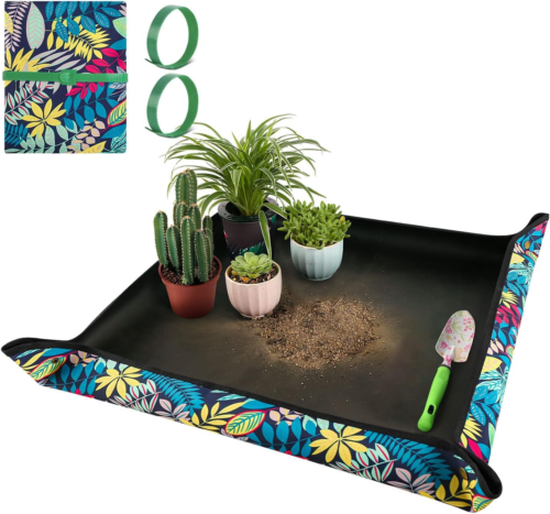 Repotting Mat shown holding 4 various sized plants and a shovel
