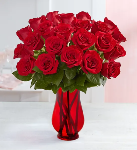 a vase of red roses